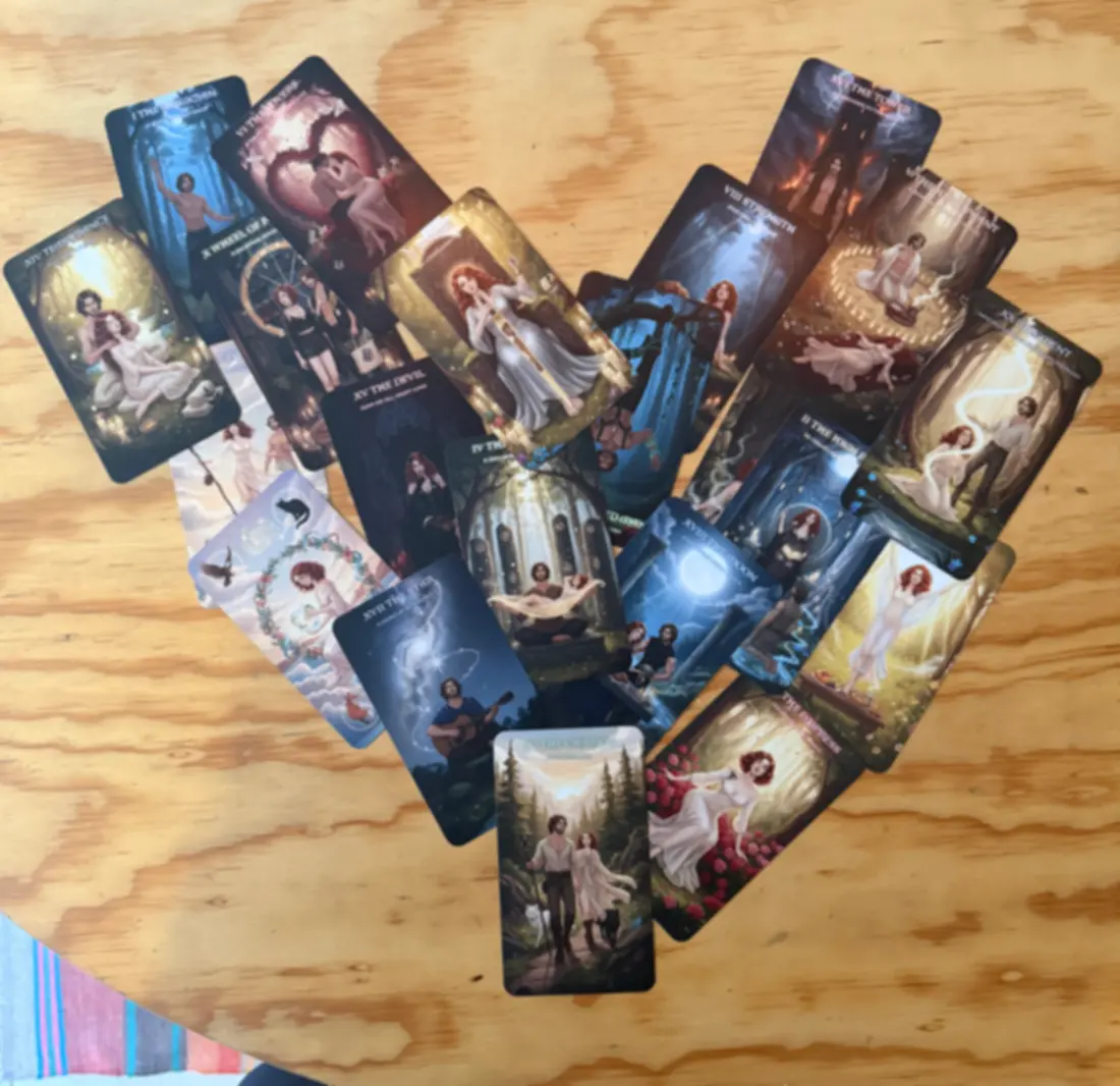 The first deck, printed and laid out in a heart on a wooden table